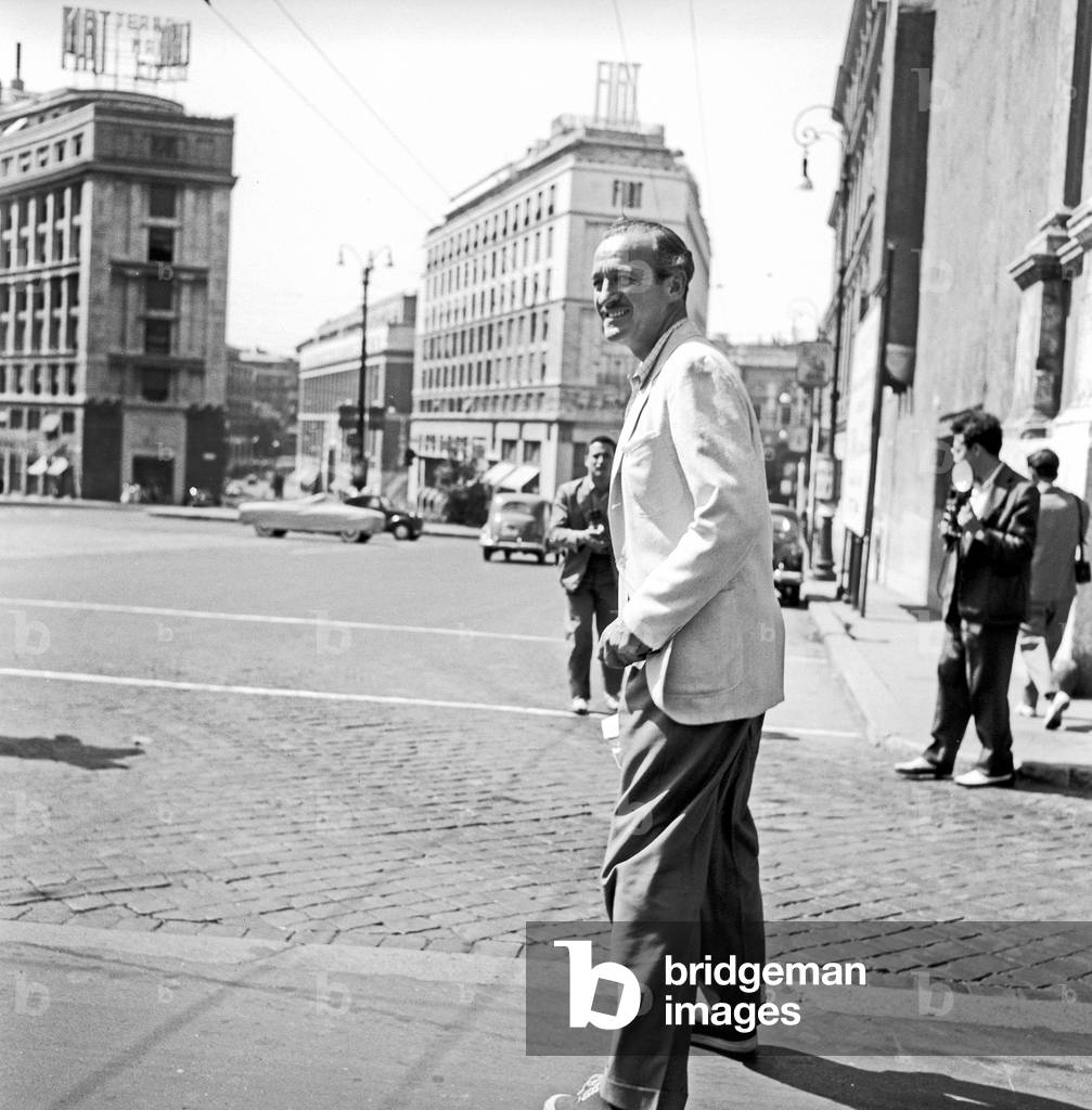 David Niven walking in Rome, Rome, Italy, 1956 (b/w photo)