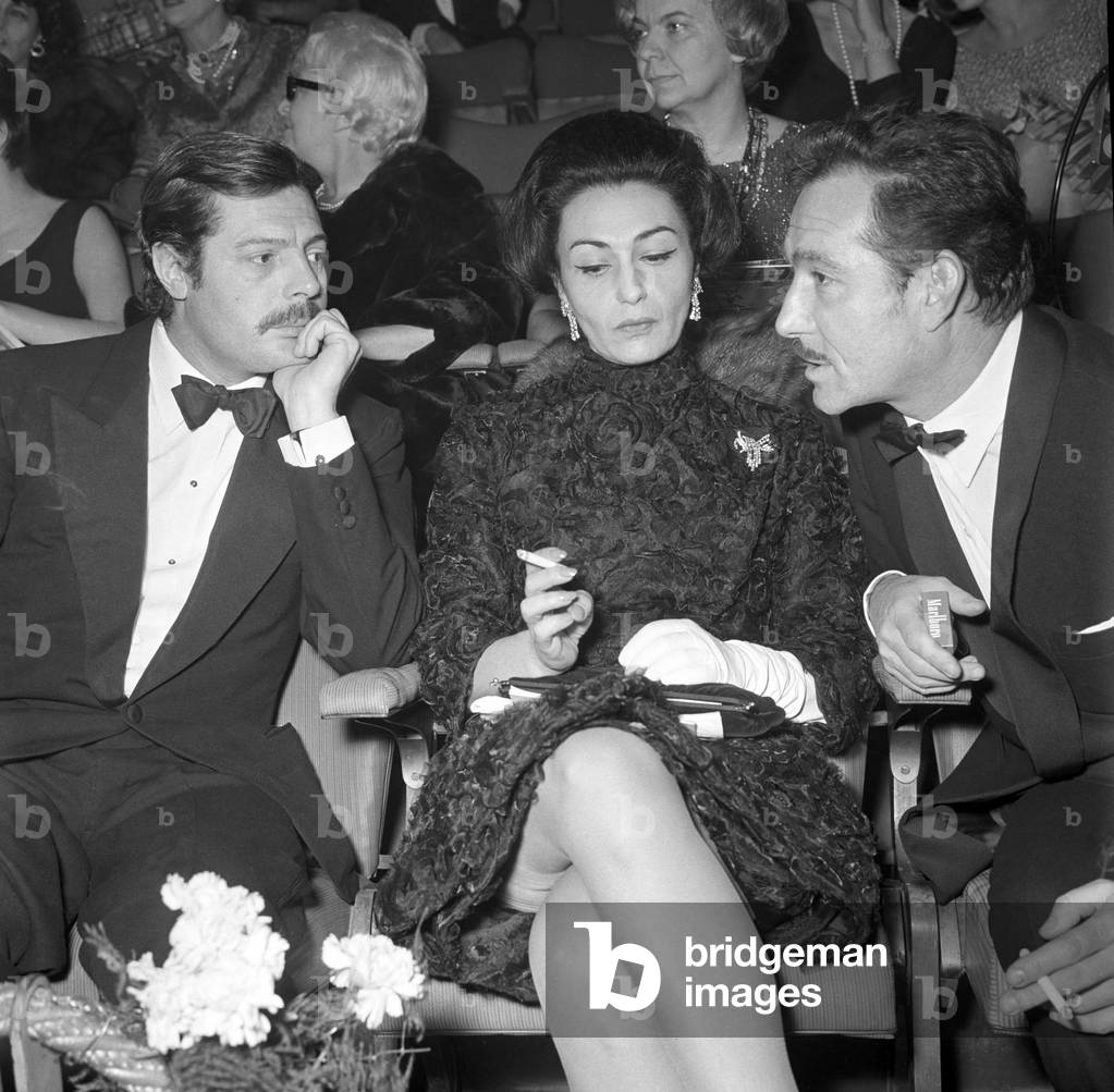 Marcello Mastroianni, Flora Carabella and Ugo Tognazzi attending the premiere of a film, Italy, 1973 (b/w photo)