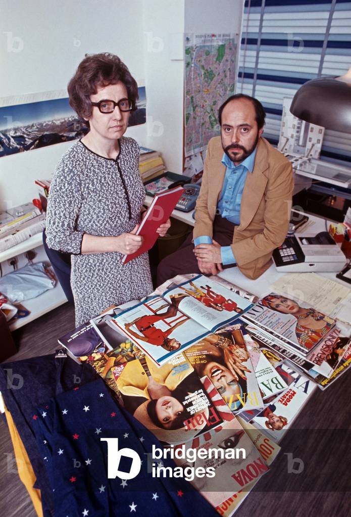 Elio Fiorucci seated in his office with a secretary, Milan, Italy