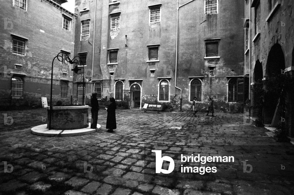 Nun with a prisoner in the courtyard of Giudecca women's prison