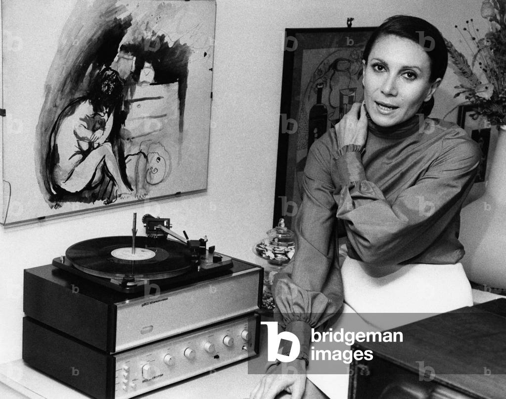 Ileana Ghione beside a record player