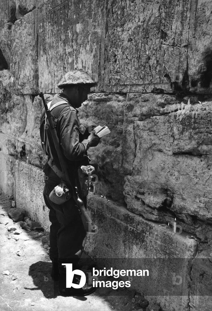 Israeli soldier in front of the Western Wall