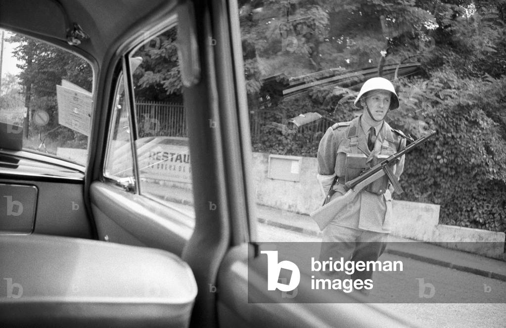 A military man patrolling a street in Geneva, Geneva, Switzerland