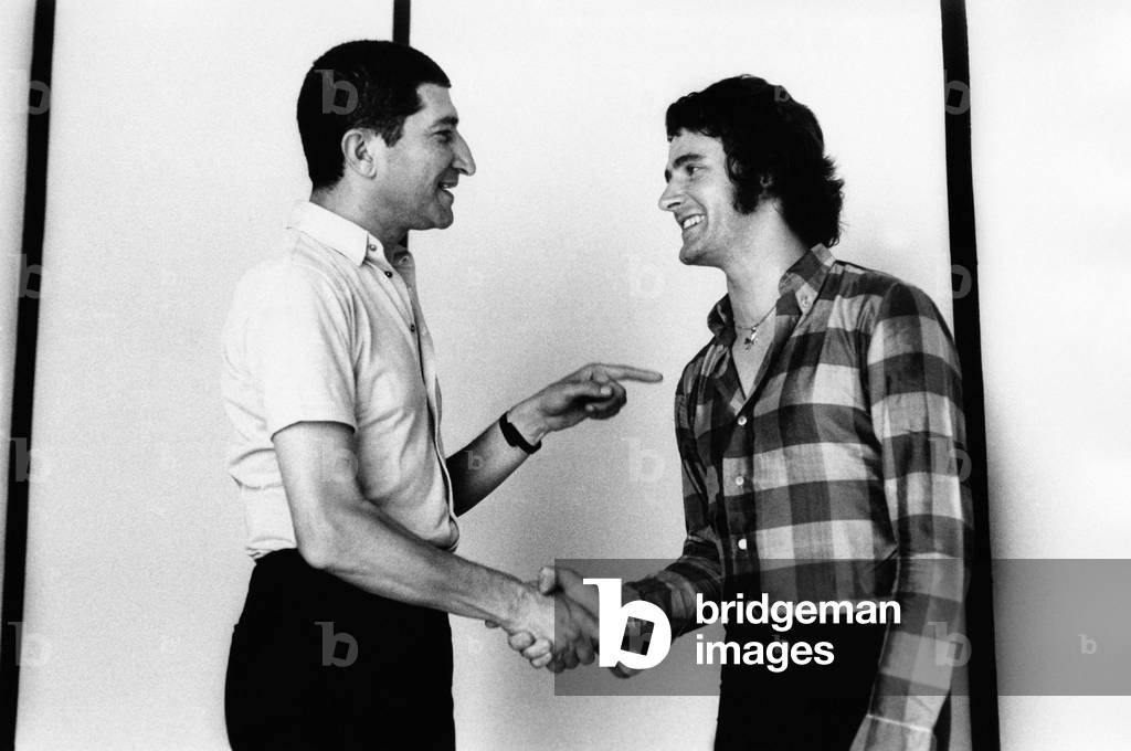 Nicola Arigliano shakes hands with Fausto Leali