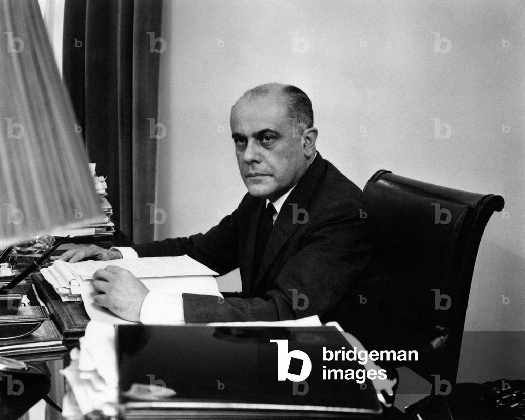 Giuorgio Bo sitting at the desk