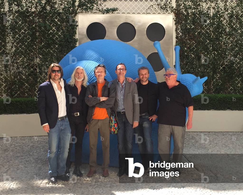 The members of Cracking Art Group: Renzo Nucara, Marco Veronese, Alex Angi, Kicco, William Sweetlowe and the CEO (Chief Executive Officer) Paolo Bettinardi posing in front of a giant white rabbit made of non-toxic and recycled plastic, Italy, 2010's (photo)