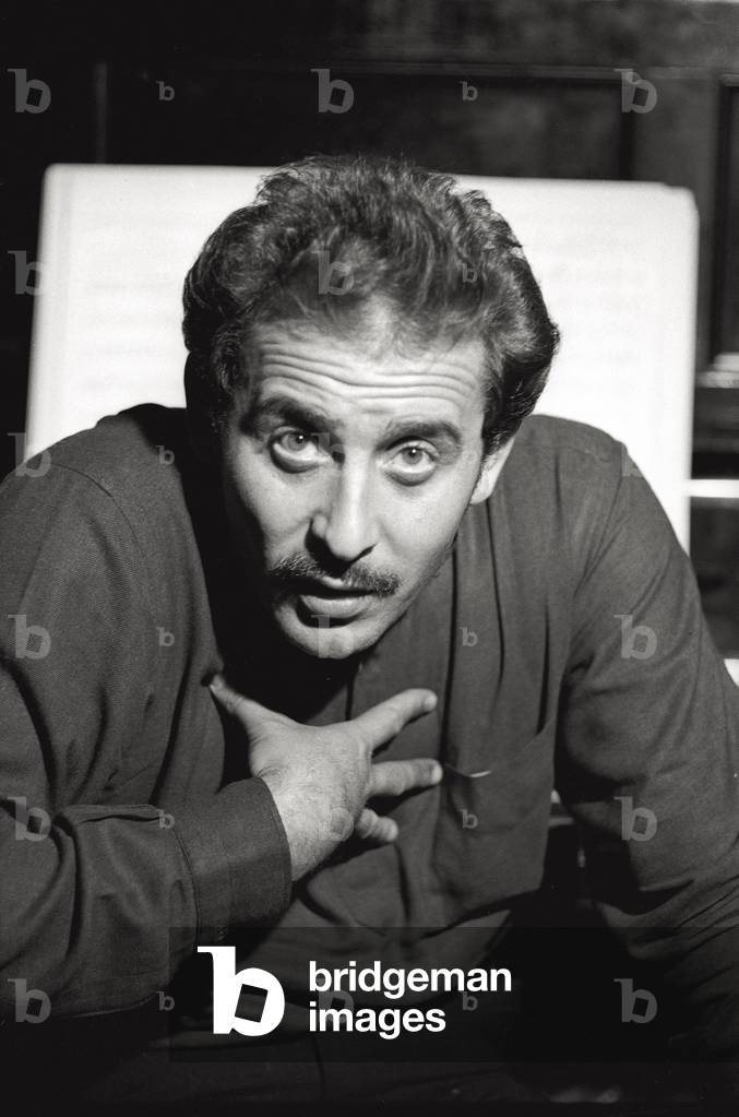 Domenico Modugno is talking with his right hand on his chest
