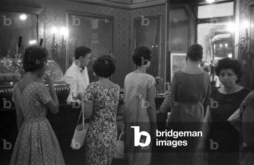 Women standing at the bar of the Antico CaffèGreco, Rome, Italy