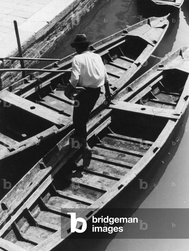 A man on a boat, Italy