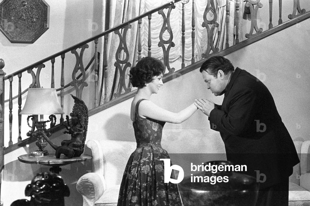 Orson Welles interviewing Gina Lollobrigida, Italy, 1958 (b/w photo)
