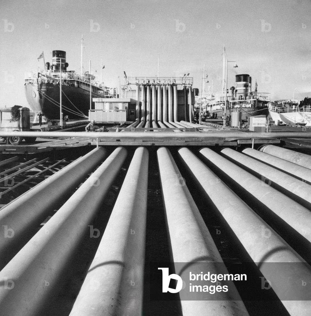 Close-up of pipelines on the background of two oil tankers, Ahmadi, Kuwait