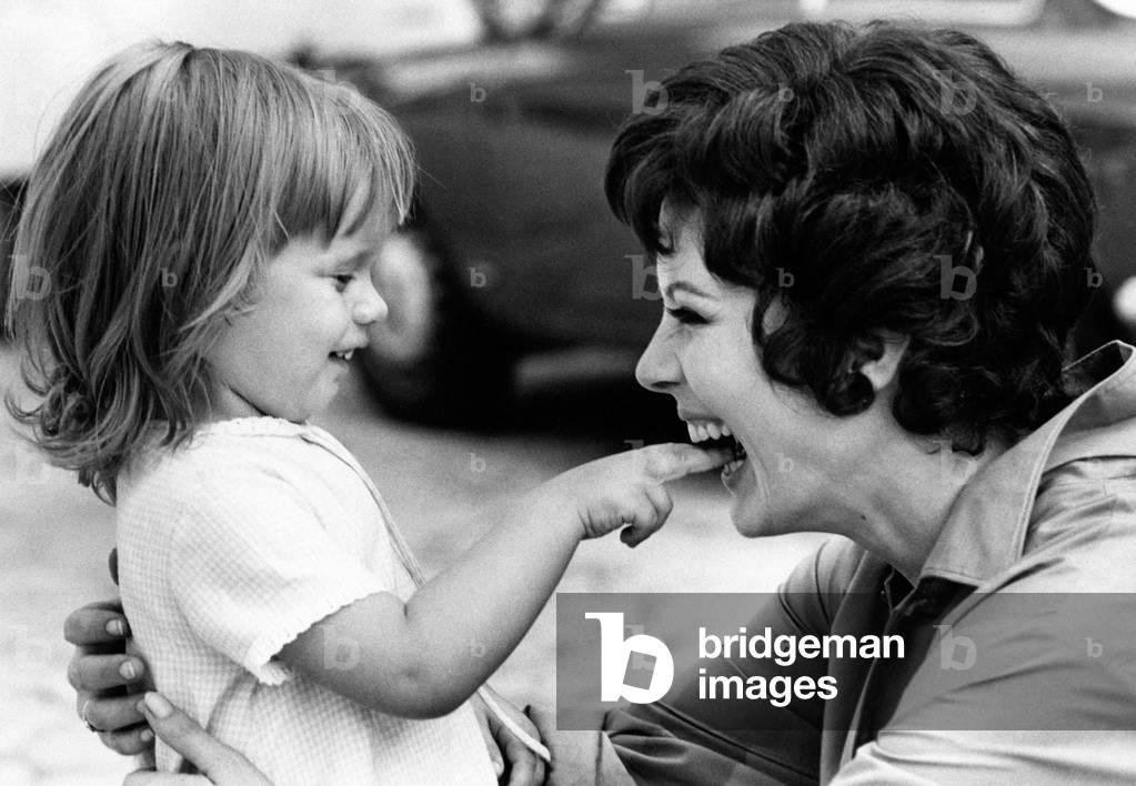 Mimsy Farmer playing with her daughter