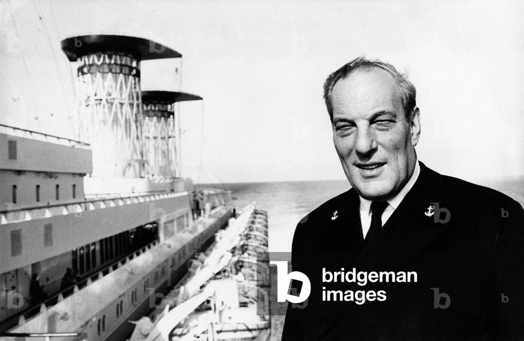 Mario Crepaz poses beside the transatlantic Michelangelo