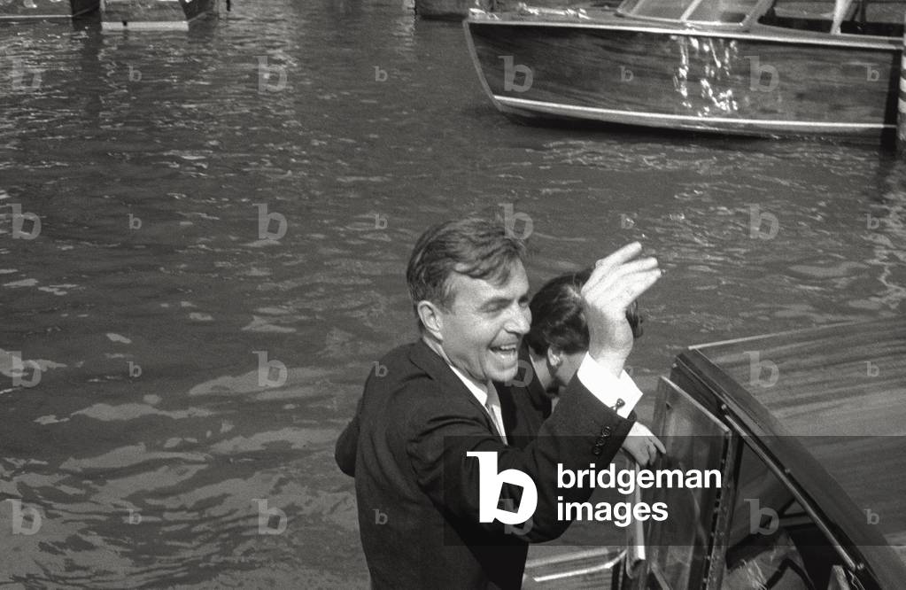 James Mason on boat greets his admires, 1956 (b/w photo)