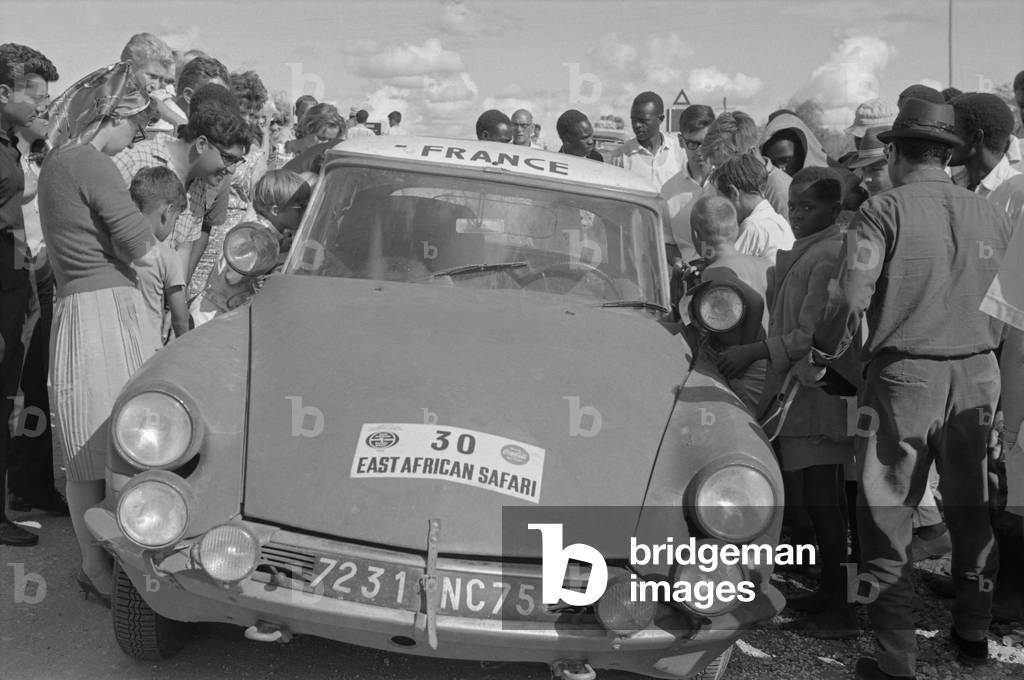 Car running from Kajiado to Nairobi during the East African Safari Rally, Kenya, April 1965 (b/w photo)
