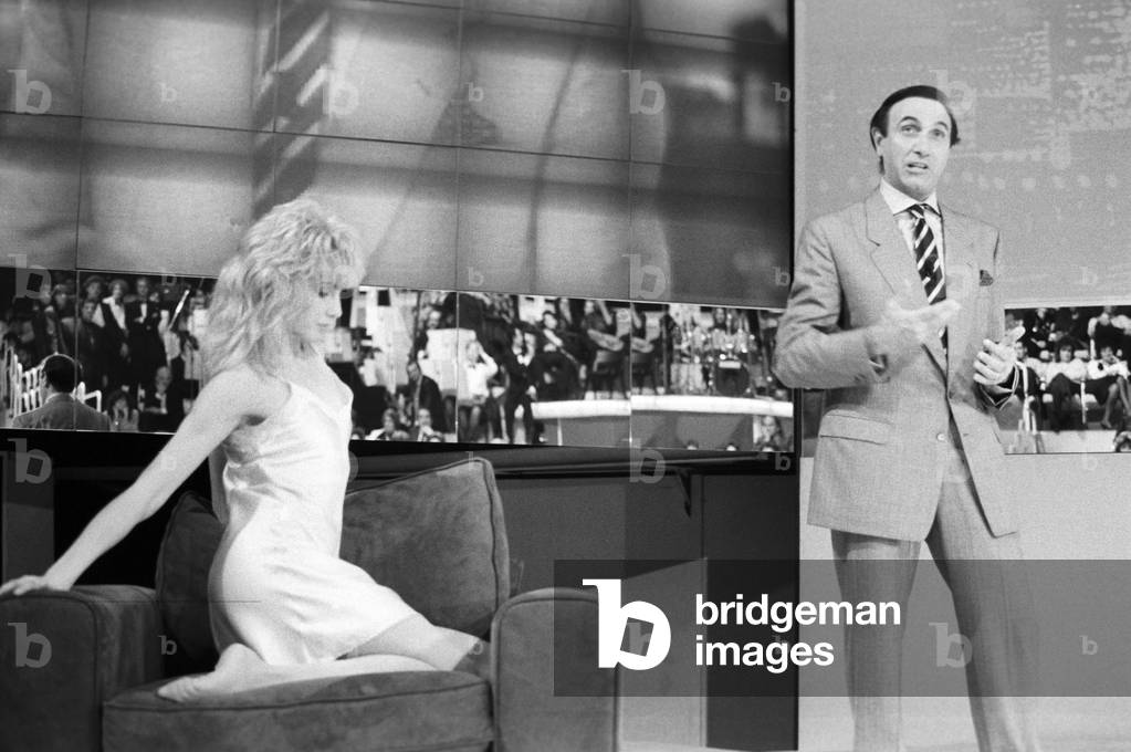 Italian TV host Pippo Baudo with Lorella Cuccarini, Italy, 1987 (b/w photo)