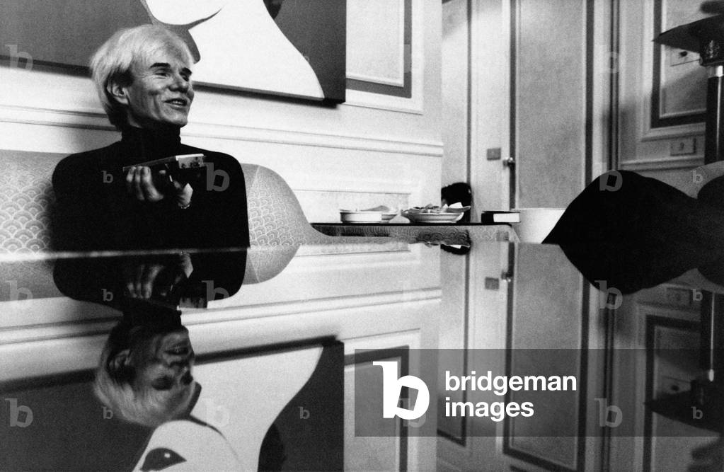 A smiling Andy Warhol