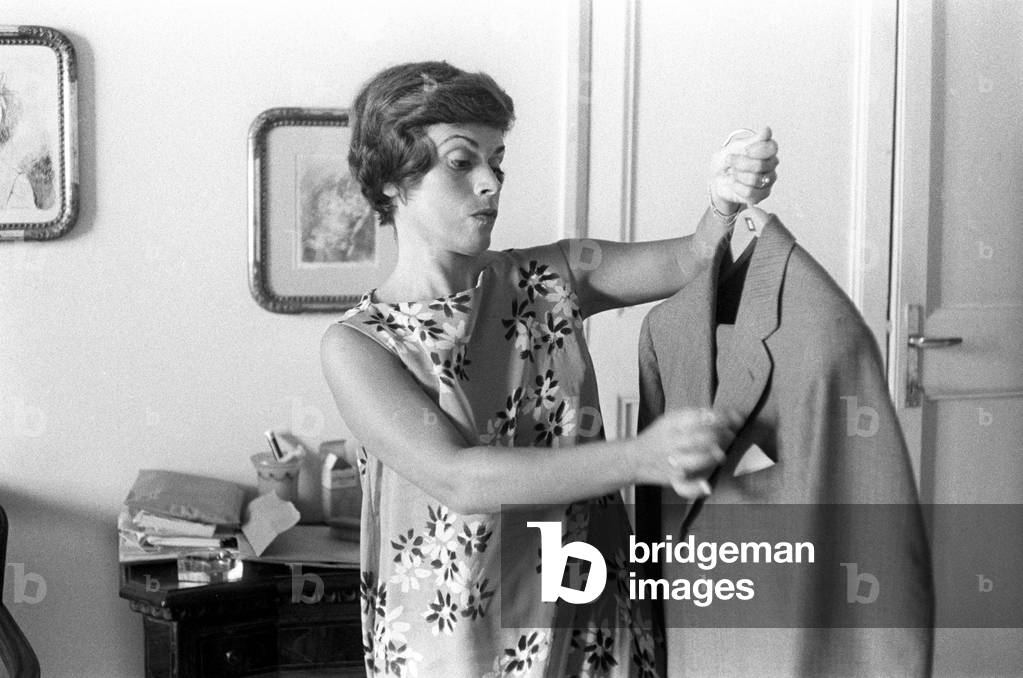 Franca Valeri brushes a jacket