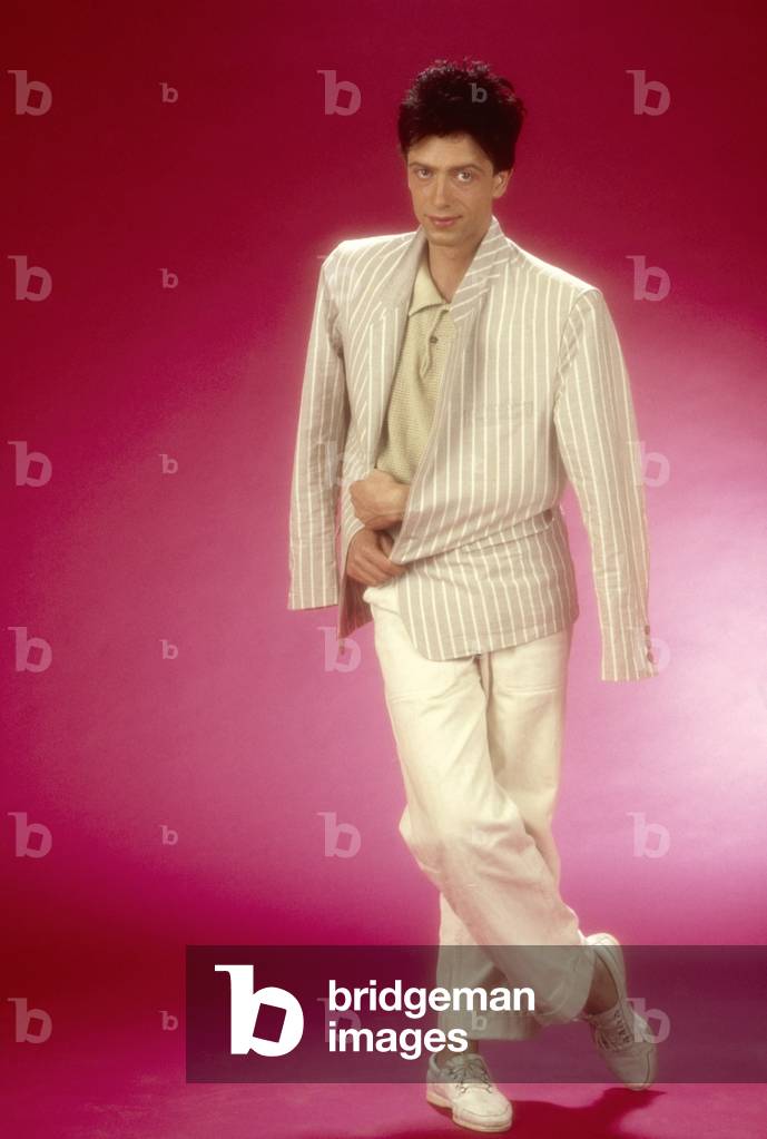 Raf posing with a jacket on his shoulder, Italy