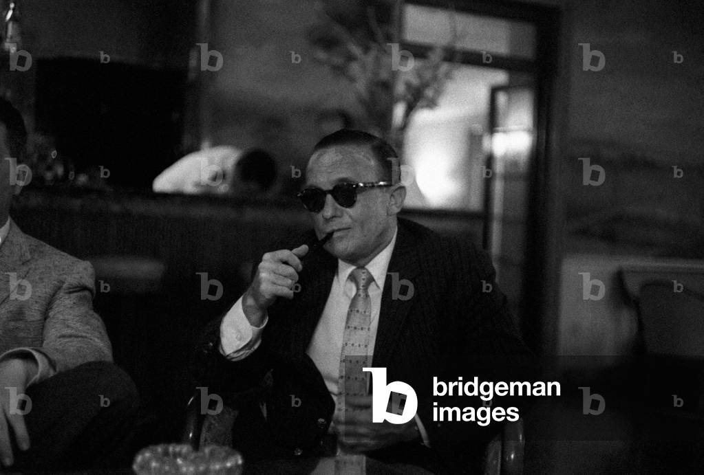 Victor Riesel smoking a pipe, Venice, Italy, 1957