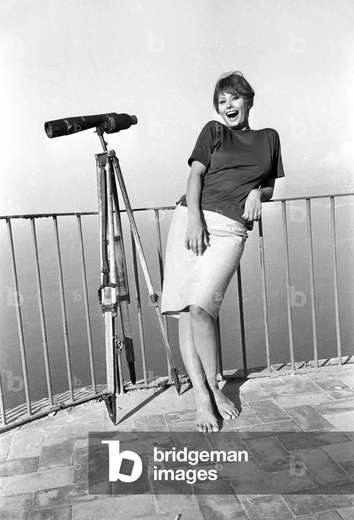 Sophia Loren near a telescope, 1959 (b/w photo)