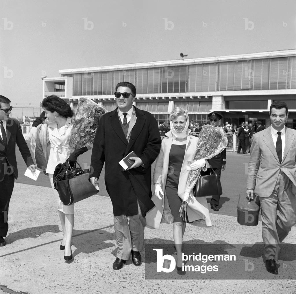 Yvonne Furneaux, Giulietta Masina and Federico Fellini at Ciampino Airport, Italy, 1960 (b/w photo)