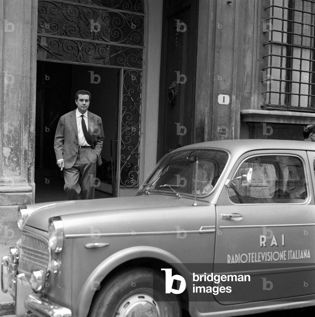 Enzo Tortora coming out of the Rai studios to where a company car awaits him