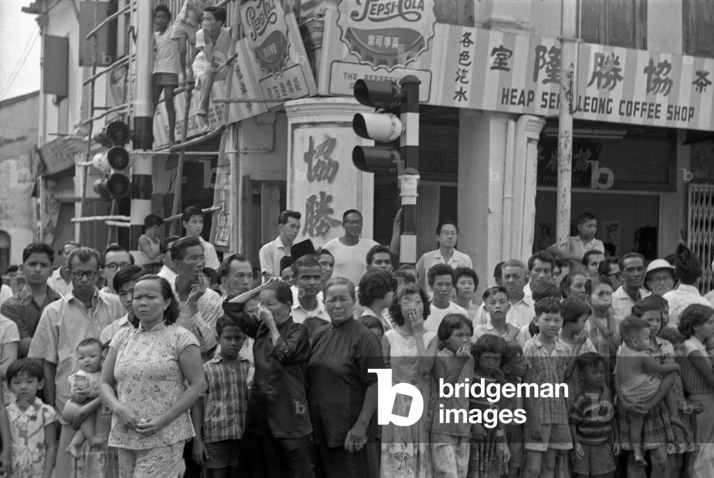 Singapore citizens in a street, Singapore, 1962 (b/w photo)