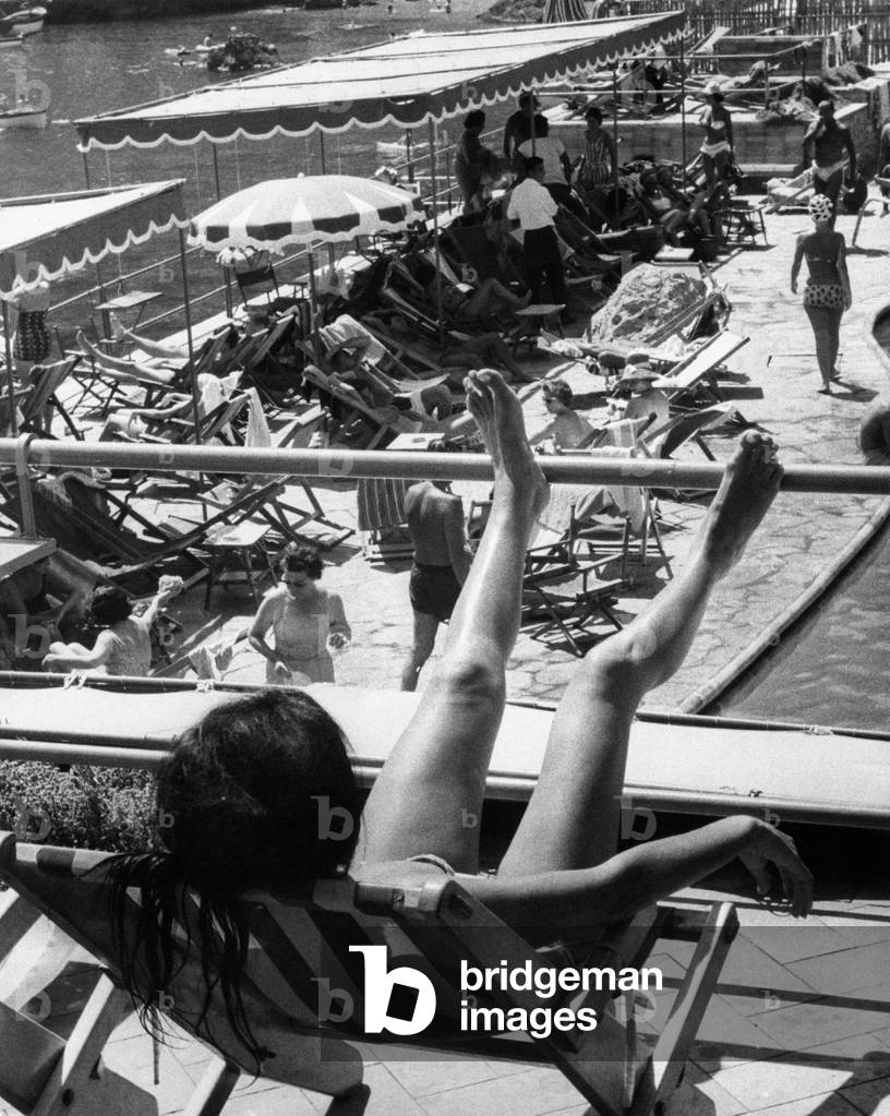 A woman sunbathing, Capri, Italy, 1962