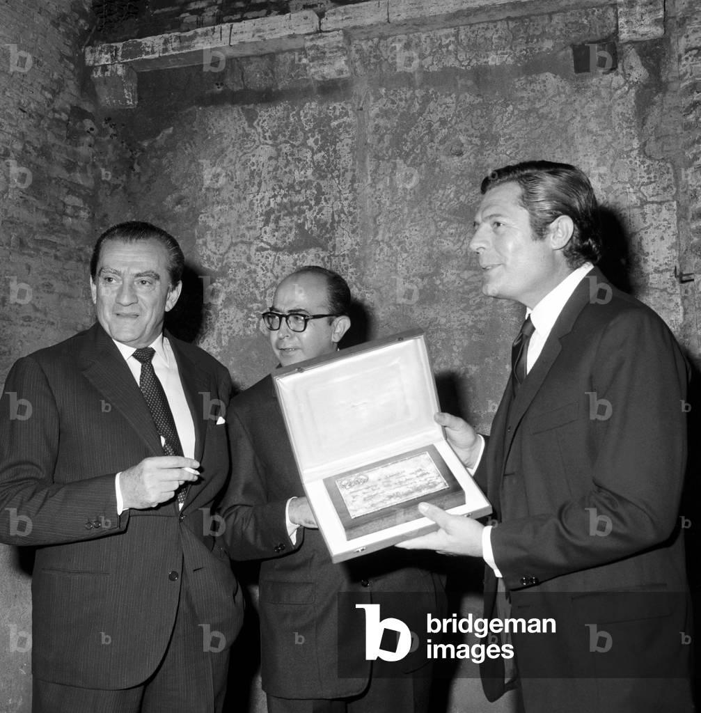 Marcello Mastroianni and Luchino Visconti attending an awarding ceremony, Italy, 1972 (b/w photo)