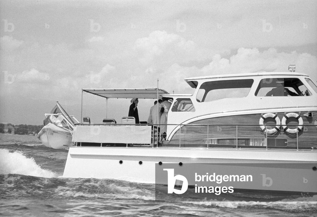A woman on a boat trip during the Geneva Summit, Geneva, Switzerland