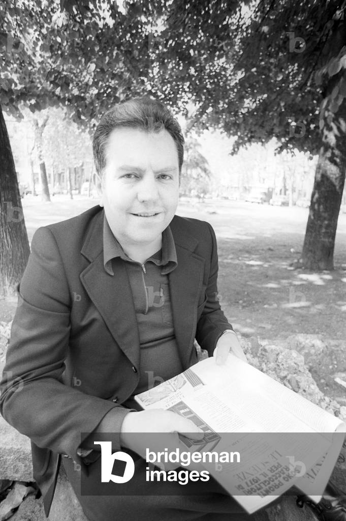Giuseppe Pontiggia seated in a park