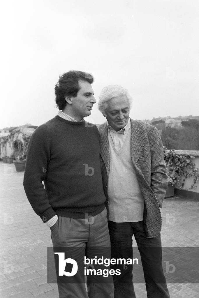 Dino Risi and his son Marco on the terrace at home, Italy, 1983 (b/w photo)