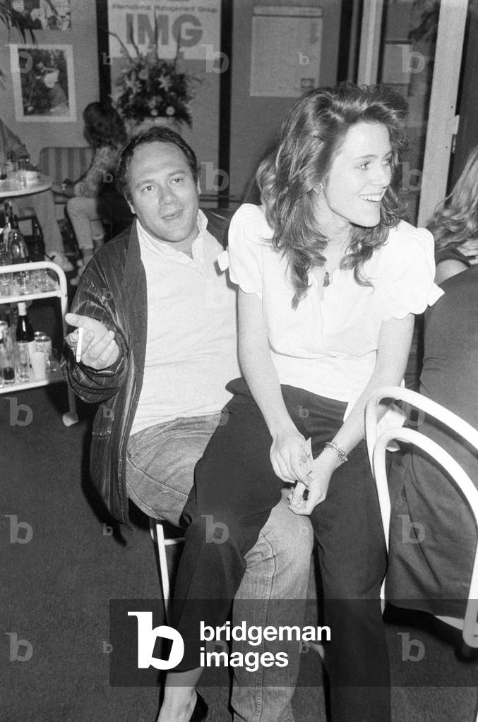 Natasha Hovey sitting on the lap of Carlo Verdone, Italy, 1982 (b/w photo)
