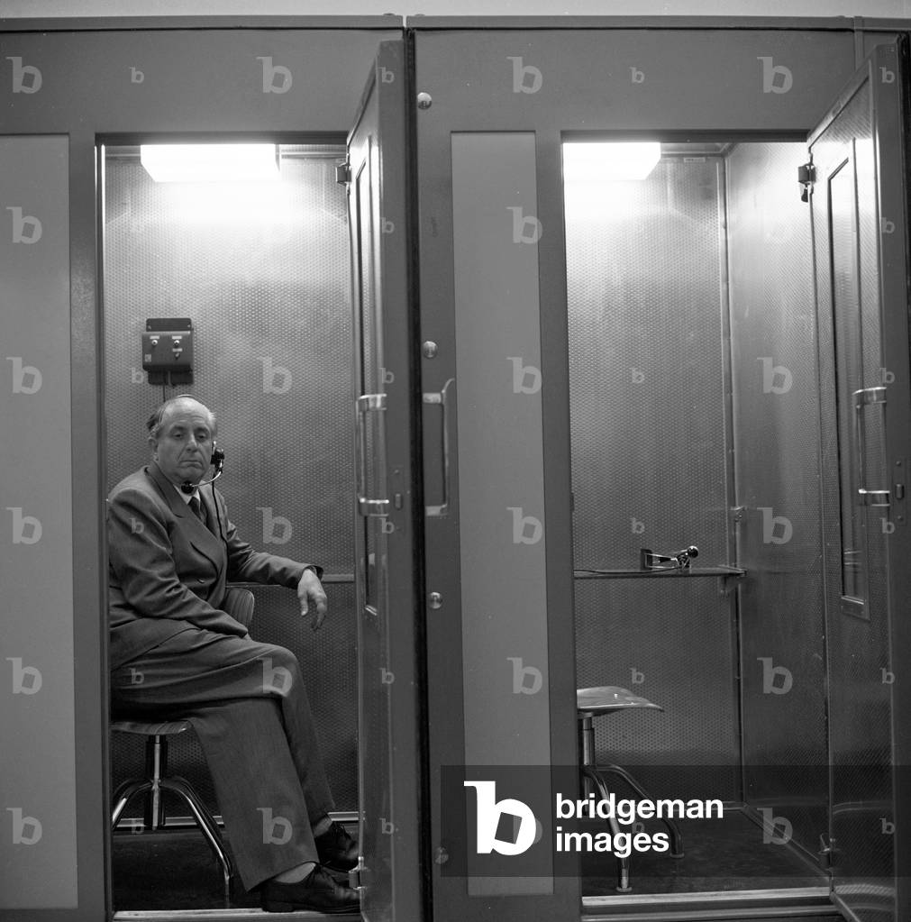 Enrico Mattei in a call box, Italy, 1961 (b/w photo)