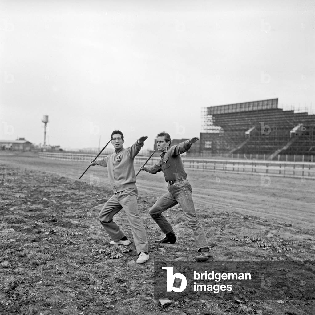 Charlton Heston training in the throwing of the javelin on the movie set of Ben Hur, Rome, Italy, 1958 (b/w photo)