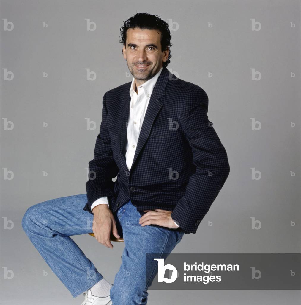 Massimo Troisi sitting on a stool, Italy