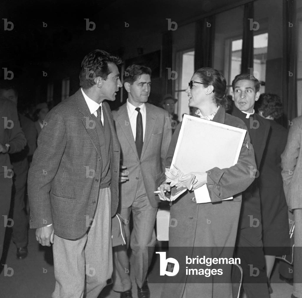 Walter Chiari and Ava Gardner arriving at Ciampino airport, Italy, 1956 (b/w photo)