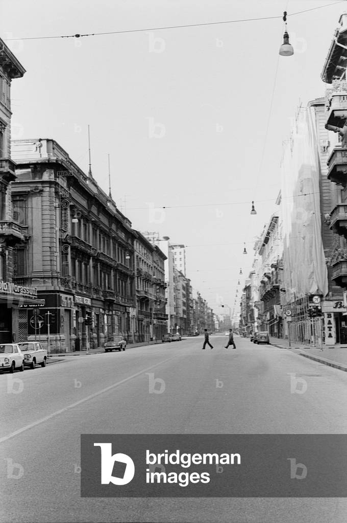 A road in Milan with no cars on August 15th, Italy, 1968 (b/w photo)