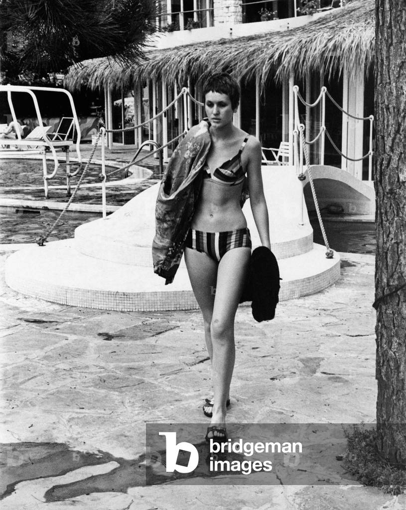Julie Driscoll beside a swimming pool