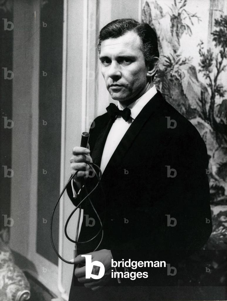 Paolo Ferrari holding a microphone