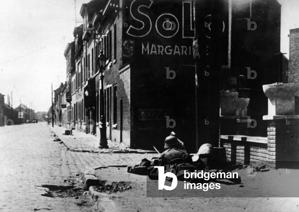 German soldier in wait in a street