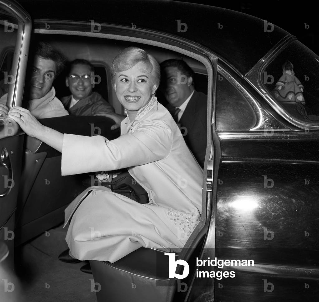 Giulietta Masina, Federico Fellini and Riccardo Fellini in a car, Italy, 1957 (b/w photo)