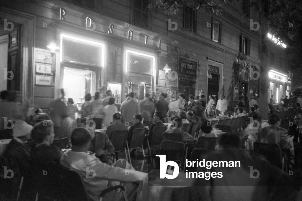 People sitting outside the CaffèRosati in Rome