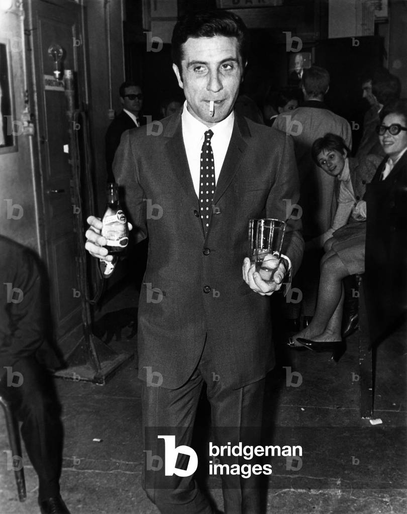 Gilbert Bécaud smoking a cigarette