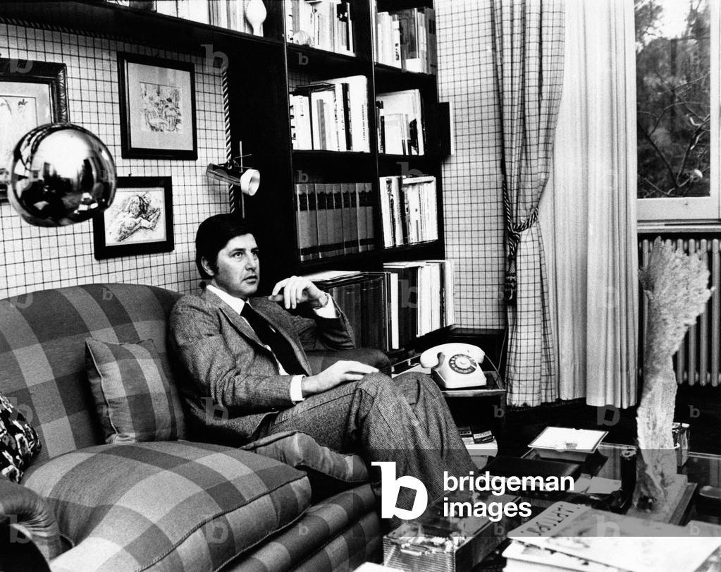 Antonello Falqui on a sofa