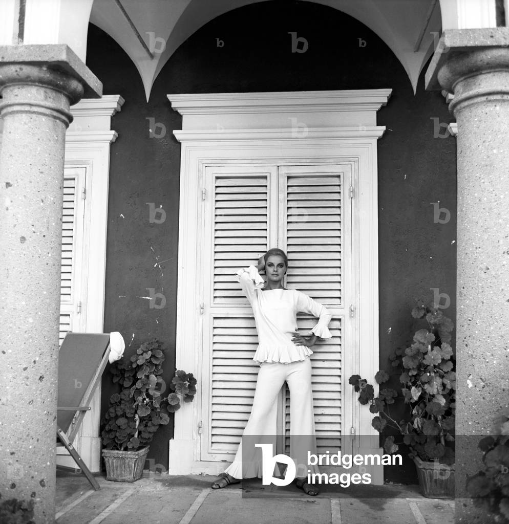 Virna Lisi poses under the portico of her villa near Rome, Rome, Italy, 1964
