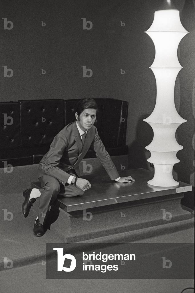 Valentino posing in his atelier