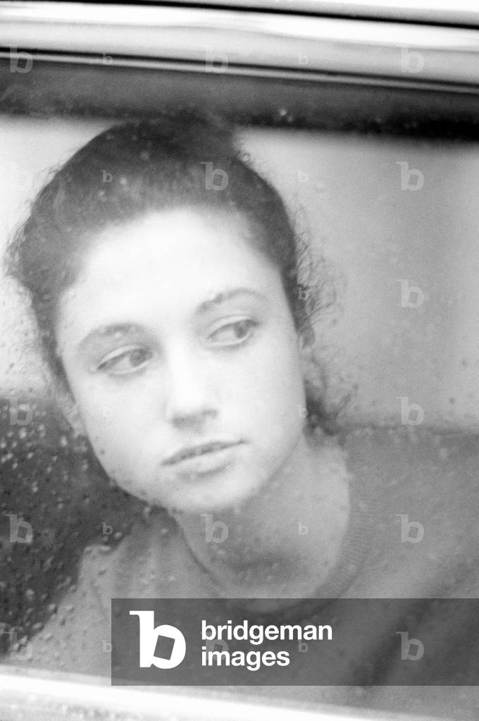 Close-up of Gigliola Cinquetti while she is looking out of a window