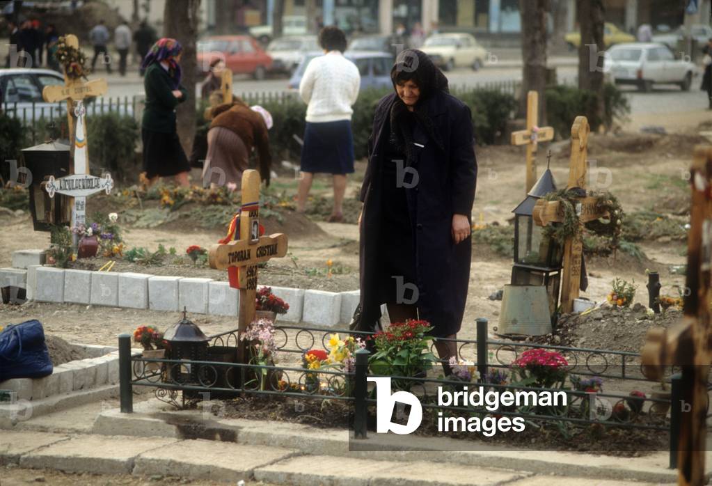 Elderly woman at the cemetery